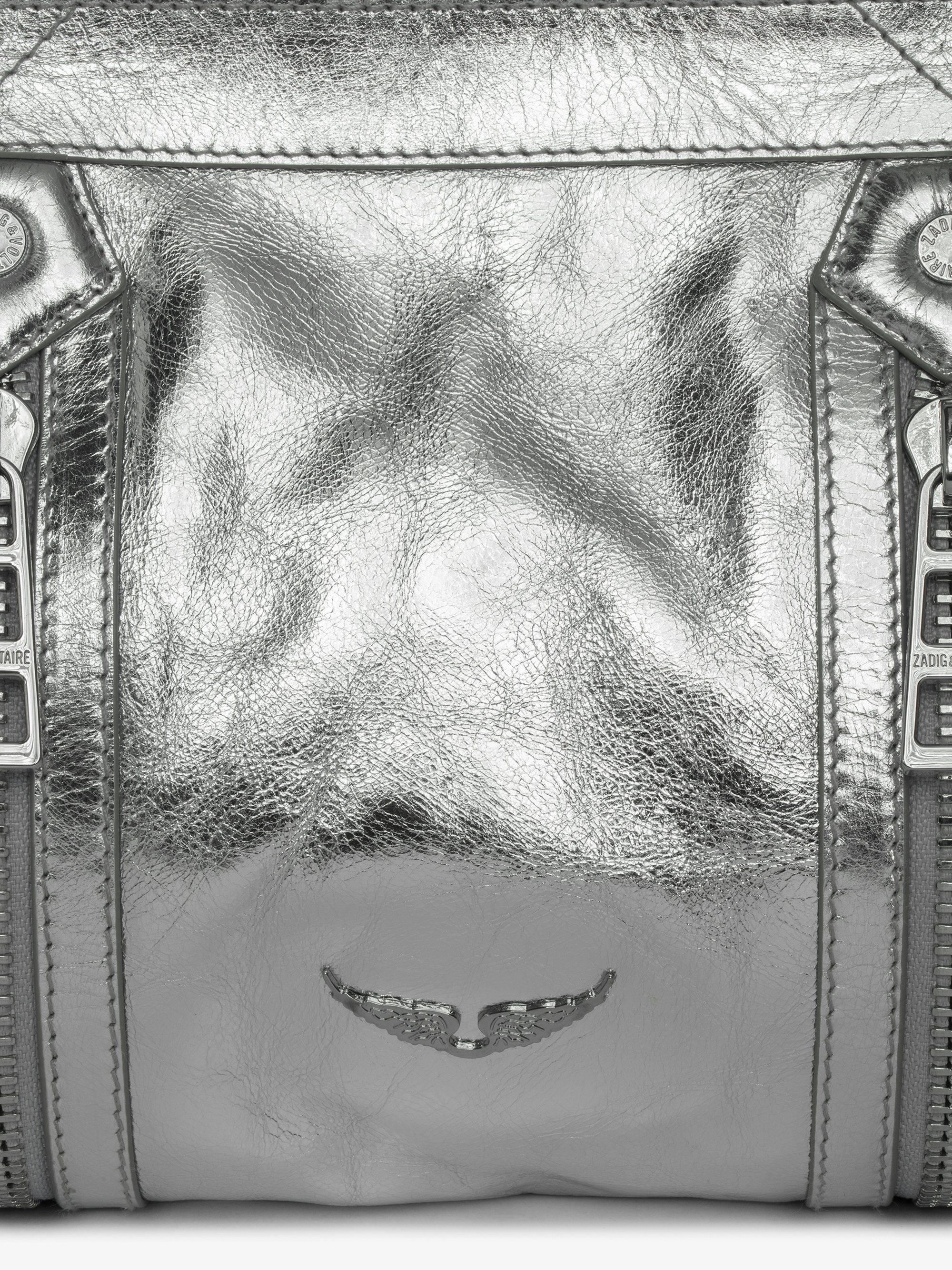 Sunny Moody Vintage Metal Bag - Metallic leather bag with adjustable shoulder strap and wing signature.